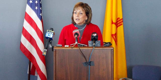 New Mexican Governor Susana Martinez makes announcements regarding gas shortages from the Emergency Operating Center on the National Guard Base just south of Santa Fe, N.M., on Thursday, Feb. 3, 2011. Secretary of Homeland Security and Emergency Management Michael Duvall, left, and Major General Kenny C. Montoya, right, look on. Martinez has declared a state of emergency as thousands of New Mexico residents lost natural gas service due to the bitter cold. Martinez sent all nonessential state workers home for the day Thursday, and urged all residents to turn down their thermostats, bundle up and shut off appliances they don't need for the next 24 hours. (AP Photo/The New Mexican, Natalie Guillén)