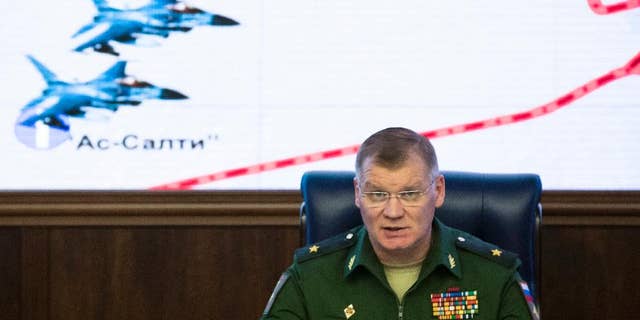 Russian Defense Ministry spokesman Maj. Gen. Igor Konashenkov speaks at a briefing in the Russian Defense Ministry's headquarters in Moscow, Russia, Thursday, Oct. 20, 2016. The Russian military is pressing its accusations against the U.S.-led coalition over a strike on a Syrian village. (AP Photo/Pavel Golovkin)