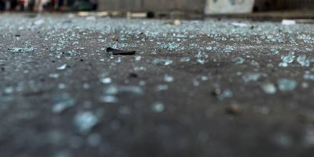 Glass pieces on the ground outside a foreign ministry building that was damaged by a powerful blast on September 11, 2013 in Benghazi.