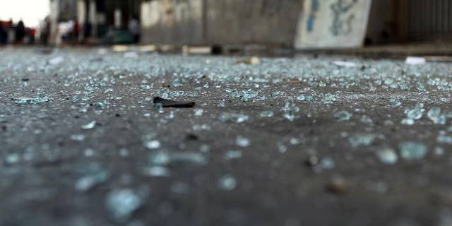 Glass pieces on the ground outside a foreign ministry building that was damaged by a powerful blast on September 11, 2013 in Benghazi.