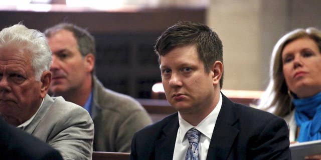 FILE - In this May 5, 2016, file photo, Chicago police officer Jason Van Dyke, charged with first-degree murder in the October 2014 shooting death of a black teenager, sits in court for a hearing in his case in Chicago. Van Dyke's family, with the officer's approval, has spoken out publicly for the first time since he was charged with murder in an interview with the Chicago Tribune. Van Dyke followed his attorney's advice in declining to be interviewed himself. (Nancy Stone/Chicago Tribune via AP, Pool, File)