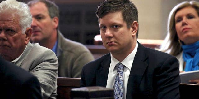 FILE - In this May 5, 2016, file photo, Chicago police officer Jason Van Dyke, charged with first-degree murder in the October 2014 shooting death of a black teenager, sits in court for a hearing in his case in Chicago. Van Dyke's family, with the officer's approval, has spoken out publicly for the first time since he was charged with murder in an interview with the Chicago Tribune. Van Dyke followed his attorney's advice in declining to be interviewed himself. (Nancy Stone/Chicago Tribune via AP, Pool, File)