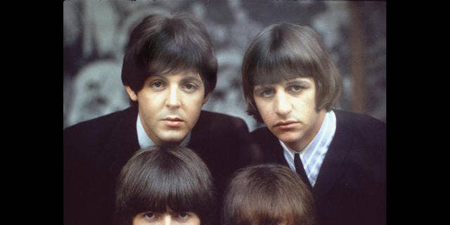 The Beatles are shown on an album cover in 1965.  Clockwise, from top left, are: Paul McCartney, Ringo Starr, John Lennon, and George Harrison.