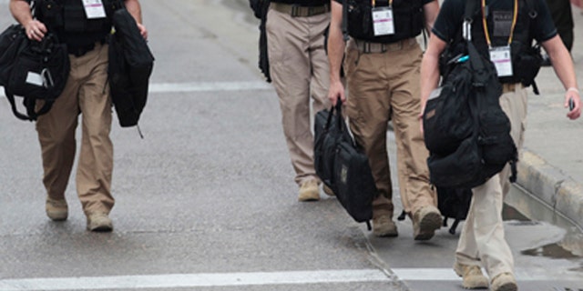 April 14, 2012: U.S. Secret Service agents walk around the Convention Center in Cartagena, Colombia, prior to the Summit of the Americas.