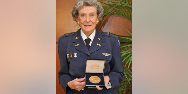 Bernice Haydu pictured with the Congressional Gold Medal.