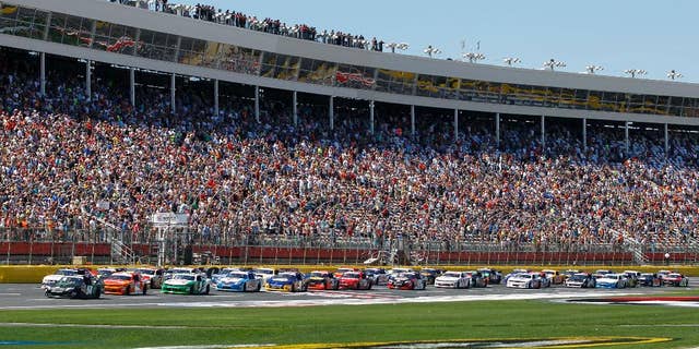 The field takes the green flag to start the NASCAR Nationwide series History 300 auto race at Charlotte Motor Speedway in Concord, N.C., Saturday, May 24, 2014. (AP Photo/Terry Renna)