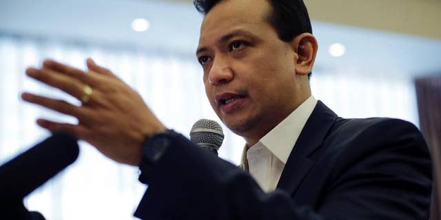 Philippine Sen. and vice presidential candidate Antonio Trillanes IV gestures as he answers questions during a forum with the Foreign Correspondents Association of the Philippines in Manila, Philippines Tuesday, May 3, 2016. Trillanes alleged that the Philippine presidential front-runner Rodrigo Duterte had a large sum of money in an undeclared bank account. The allegations have not been resolved Monday, allowing the issue to hang over the final week of the closely fought presidential race. (AP Photo/Aaron Favila)