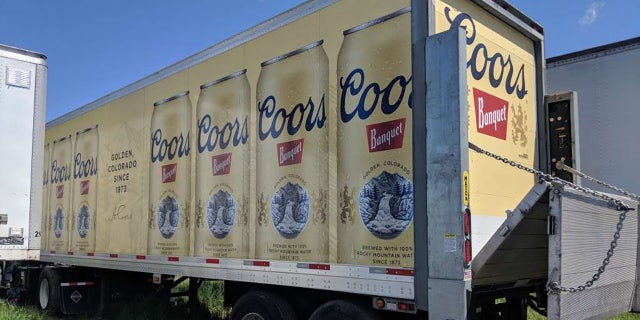 This Coors truck was stolen while its driver was making a delivery inside a store, police say.