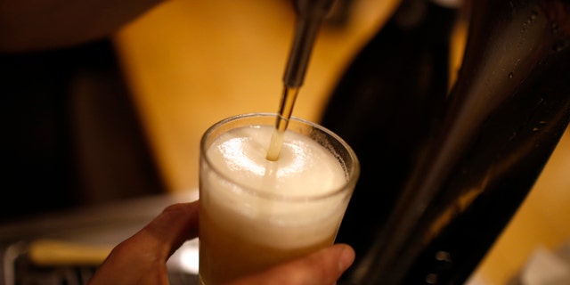 A glass of beer is served at a bar in Madrid, March 3, 2016. REUTERS/Juan Medina - RTS9ALD