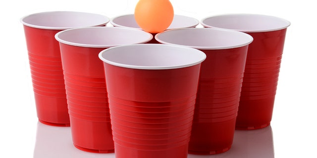 The family of a Connecticut man who died in 2013 after falling out of a window following a game of beer pong, like these people are playing here, was awarded $15.6 million.
