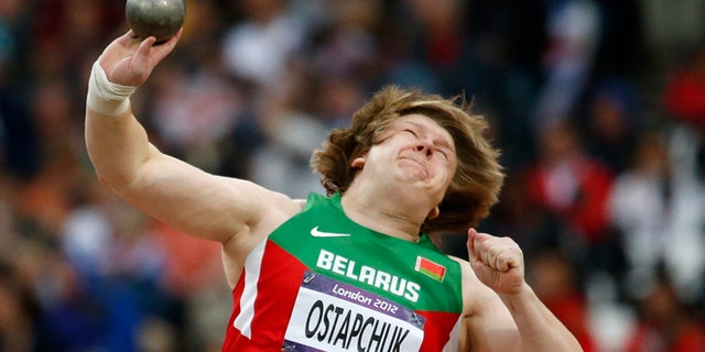 Aug. 6, 2012: In this file photo, Belarus' Nadzeya Ostapchuk takes a throw in the women's shot put final during the athletics in the Olympic Stadium at the 2012 Summer Olympics, London. Ostapchuk became the first athlete to be stripped of a medal at the London Olympics after her gold was withdrawn for doping. Valerie Adams of New Zealand will now take gold and Evgeniia Kolodko of Russia will get silver. Fourth-place finisher Gong Lijiao of China moves up to bronze.