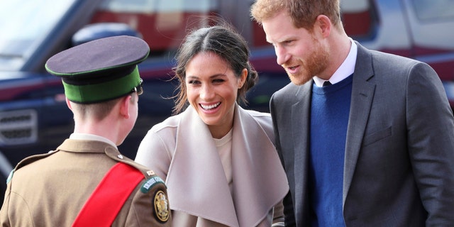 Britain's Prince Harry and Meghan Markle arrive for a visit to the Eikon Exhibition Centre in Lisburn, Northern Ireland  where they attended an event to mark the second year of youth-led peace-building initiative Amazing the Space Friday March 23, 2018. Prince Harry and Meghan will get married at St. George's Chapel in Windsor Castle on Saturday May 19.  (Brian Lawless/PA via AP)