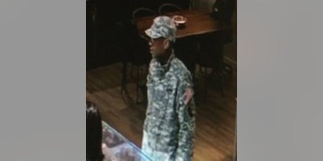 Police released an image of a suspect identified as Arquae Daveon Kennedy, 26. He is accused of impersonating a soldier and stealing a $100,000 marquise diamond on Feb. 22, authorities said Wednesday.