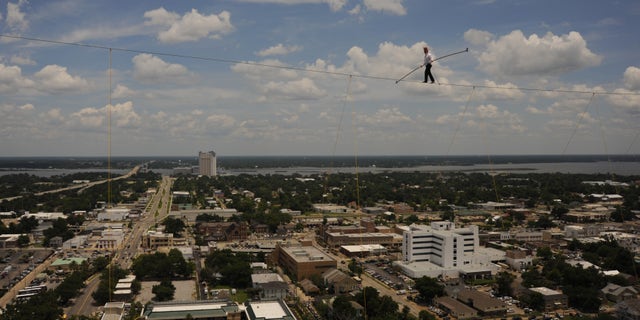 June 21: Comic and daredevil performer Bello Nock walks across a tightrope suspended 32 stories high between spans of the Beau Rivage Resort & Casino in Biloxi, Miss.