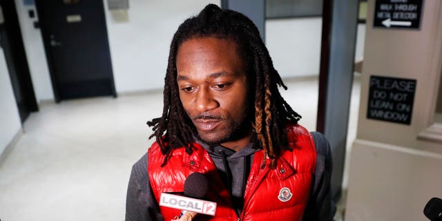 Bengals cornerback Adam "Pacman" Jones speaks to reporters as he is released from the Hamilton County Justice Center after be charged with felony harassment with a bodily substance, , Wednesday, Jan. 4, 2017, in Cincinnati. He is also charged with assault, disorderly conduct and obstructing police. An attorney representing Jones has told a Hamilton County judge that he "vehemently denies" the charges that led to his arrest. (AP Photo/John Minchillo)