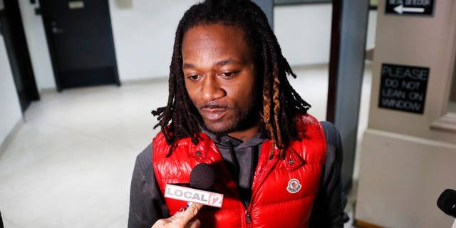 Bengals cornerback Adam "Pacman" Jones speaks to reporters as he is released from the Hamilton County Justice Center after be charged with felony harassment with a bodily substance, , Wednesday, Jan. 4, 2017, in Cincinnati. He is also charged with assault, disorderly conduct and obstructing police. An attorney representing Jones has told a Hamilton County judge that he "vehemently denies" the charges that led to his arrest. (AP Photo/John Minchillo)