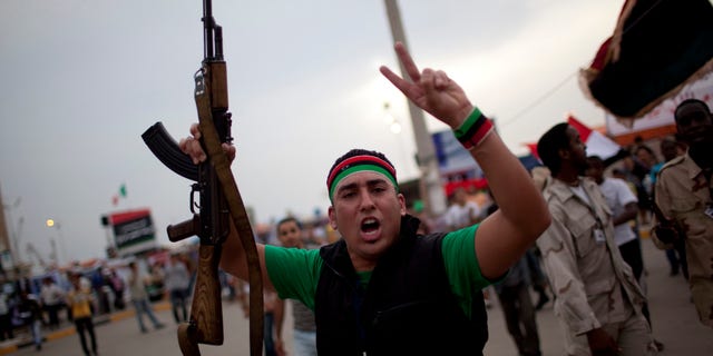 A man chants anti-Muammar Qaddafi slogans during a protest in the rebel strong hold of Benghazi, Libya, Thursday, June 2, 2011. (AP)