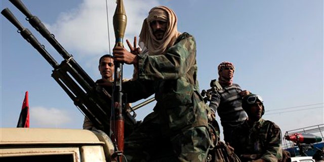 Libyan rebels take part in a military parade in Benghazi, Libya, April 27.