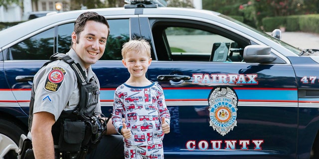 Officers posed with pictures with the boy, named Benjamin.