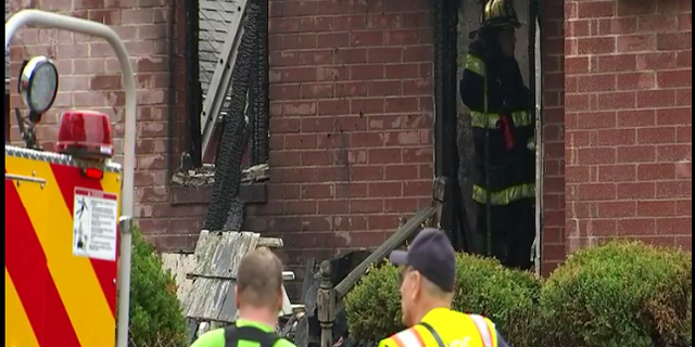 Firefighters on the scene of the fire at a Bensalem home that killed a pet owner trying to rescue her animals. (Fox)