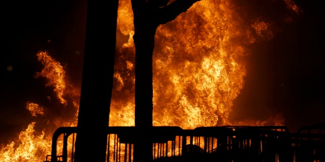 A fire set by demonstrators protesting a scheduled speaking appearance by Breitbart News editor Milo Yiannopoulos burns on Sproul Plaza on the University of California at Berkeley campus on Wednesday, Feb. 1, 2017, in Berkeley, Calif. The event was cancelled due to size of the crowd and several fires being set. (AP Photo/Ben Margot)