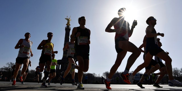 Participants run during the half marathon event in Berlin, Sunday, April 8, 2018.
