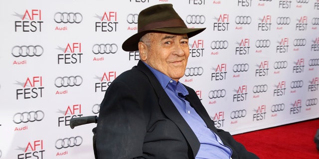 Italian director Bernardo Bertolucci smiles during an interview as he arrives for a gala screening of his film "The Last Emperor" in 3D at the AFI Fest 2013 in Hollywood, California, November 10, 2013. REUTERS/Fred Prouser (UNITED STATES - Tags: ENTERTAINMENT) - RTX158LK