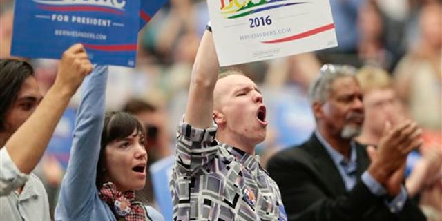 Supporters cheer as Democratic presidential candidate Sen. Bernie Sanders speaks at a political rally in Madison, Wis., Wednesday, July 1, 2015. (Michael P. King/Wisconsin State Journal via AP)