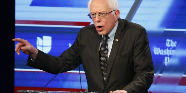 March 9, 2016: Sen. Bernie Sanders speaks at the Univision, Washington Post Democratic presidential debate at Miami-Dade College. His suit, though, was the main event. (AP)