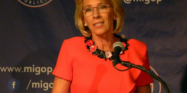 Harvard University students protested Education Secretary Betsy DeVos' visit to the campus.