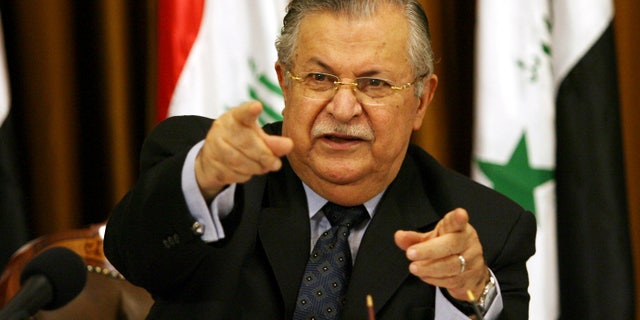 FILE - In this Aug 17, 2007 file photo, Iraq's President Jalal Talabani talks to reporters in Baghdad, Iraq. The office of Iraqi President Jalal Talabani said Tuesday he has been admitted to the hospital for treatment of an unspecified health problem.. (AP Photo/Hadi Mizban, File)