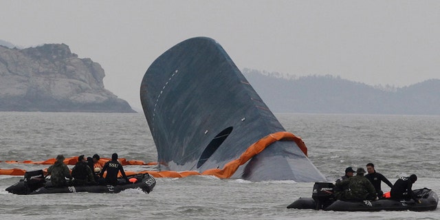 April 17, 2014: South Korean Coast Guard officers search for missing passengers aboard sunken ferry Sewol in the waters off the southern coast near Jindo, South Korea.