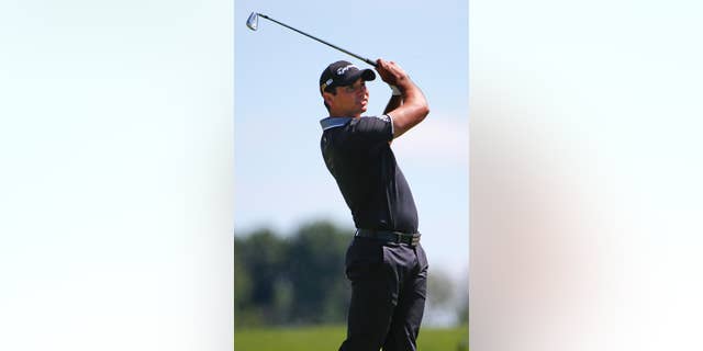 Jason Day, of Australia, hits his approach shot to the 18th green during a practice round for the 2016 US Open golf championship at Oakmont Country Club in Oakmont, Pa., Monday, June 13, 2016. (AP Photo/Gene J. Puskar)