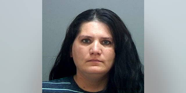This undated booking photo provided by the Salt Lake County Jail shows Nannette Perkins who was arrested Sunday, April 16, 2017, at her Taylorsville home after Salt Lake City police received a tip about her identity. Perkins is believed to be the pajama-wearing robber in at least six bank robberies in the Salt Lake City area. (Salt Lake County Jail via AP)