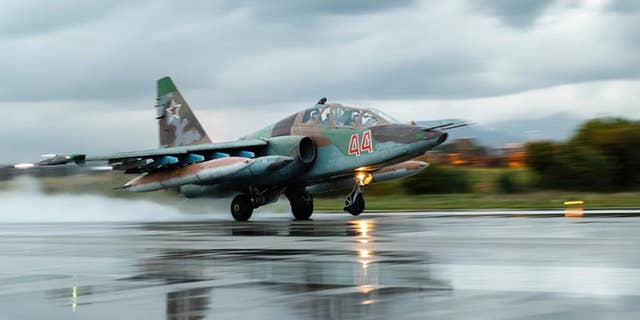March 16, 2016: A Russian Su-25 ground attack jet takes off at Hemeimeem Air Base in Syria.