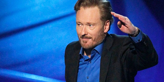 Conan O'Brien accepts the award for favorite talk show host at the 2011 People's Choice Awards in Los Angeles January 5, 2011.