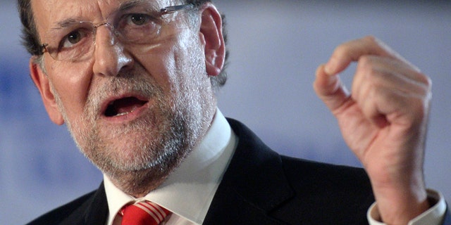 Spain's Prime Minister Mariano Rajoy gestures during his speech in Barcelona, Spain, Saturday, Nov. 29, 2014. Spains prime minister has visited the northern region of Catalonia 20 days after its government held an informal, nonbinding poll asking residents if they favored splitting from Spain. Rajoy, who was surrounded by many of his Cabinet ministers, said two-thirds of Catalans had not turned out to vote in the consultation and that the regional governments international propaganda operation had fallen apart noiselessly and without clatter". Catalan officials said out of 6.3 million potential voters, 2.3 million cast ballots, with most favoring secession. (AP Photo/Manu Fernandez)