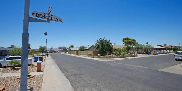 Near this block of West Berkeley Road in the Maryvale section of Phoenix, three persons died in one of a rash of shootings, shown here during the day Friday, July 8, 2016. Angela Linner, 31, Stefanie Ellis, 33, and Maleah Ellis, 12, were shot on June 12 outside a home on the street, one of the victims, Stefanie Ellis, died of her injuries this past Thursday. (AP Photo/Ross D. Franklin)