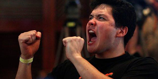 Feb. 16, 2012: A fan of NBA Knicks' Taiwanese-American Jeremy Lin watches him play against the Sacramento Kings at a local sports bar in Taipei, Taiwan.