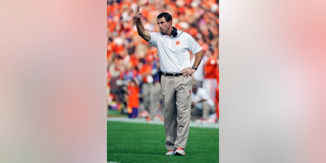 Clemson head coach Dabo Swinney gestures to his players during the first half of an NCAA college football game against Wake Forest, Saturday, Sept. 28, 2013, in Clemson, S.C. (AP Photo/Rainier Ehrhardt)