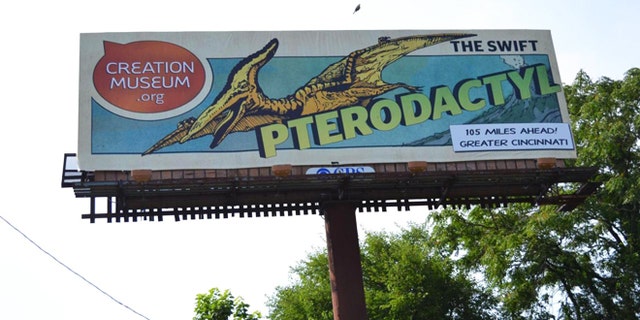 June 11, 2012: A billboard in Louisville, Ky., shows a new ad campaign for the Creation Museum. A new nationwide billboard ad campaign is using dinosaurs to attract visitors to the Bible-based center near Cincinnati. The museum has exhibits that challenge evolution science and promote a literal interpretation of the Old Testament's creation story.
