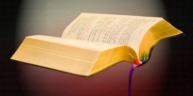 In this photo taken on April 22, 2009, Seminarian Joseph Toledo holds his bible during the morning mass at the Redemptoris Mater Archdiocesan Missionary Seminary in Denver. (AP Photo/Joel Fischer)