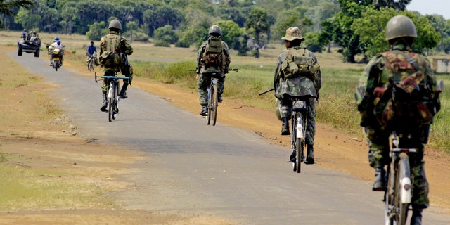 File photo - Special Task Force soldiers on bicycles patrol near Vellavely village in Sri Lanka, which was territory formerly controlled by the Tamil Tiger rebels, in Batticaloa May 28, 2007. (REUTERS/Buddhika Weerasinghe)