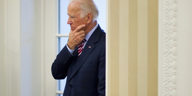 May 26, 2015: Vice President Joe Biden listens to remarks to the media during a meeting between President Barack Obama and NATO Secretary General Jens Stoltenberg in the Oval Office of the White House in Washington. (AP)