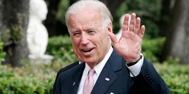 Vice President Joe Biden waves at Rome's Villa Doria Pamphili June 2.