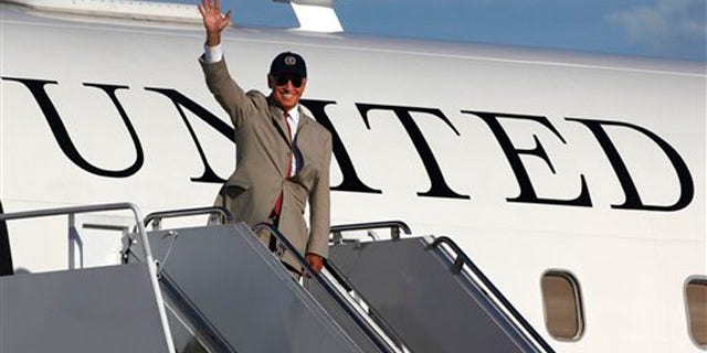 August 24: Vice President Joe Biden waves before boarding his plane at Yokota Air Base, on Tokyo's outskirts.