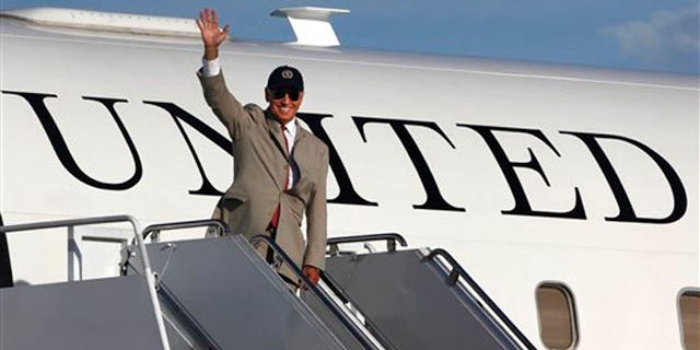 August 24: Vice President Joe Biden waves before boarding his plane at Yokota Air Base, on Tokyo's outskirts.