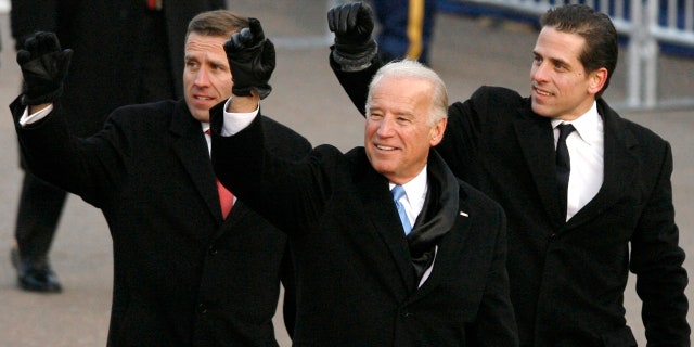 Then-U.S. Vice President Joe Biden walks with his sons Beau (L) and Hunter (R) down Pennsylvania Avenue during the inaugural parade in Washington January 20, 2009.