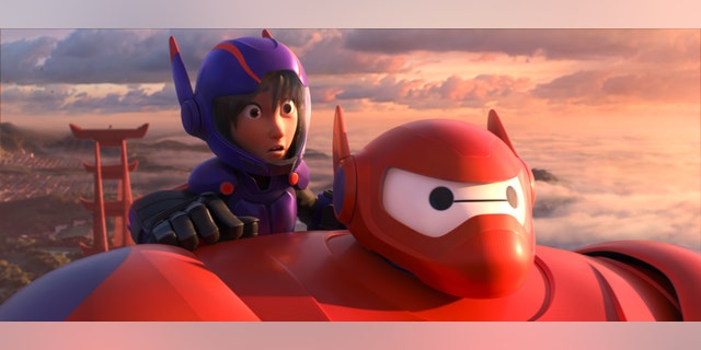 Animated characters Hiro Hamada, voiced by Ryan Potter, left, and Baymax, voiced by Scott Adsit, in a scene from "Big Hero 6."