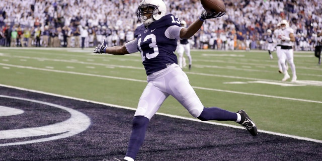 Penn State's Saeed Blacknall celebrates after scoring on a 40-yard touchdown reception during the first half of the Big Ten championship NCAA college football game against Wisconsin, Saturday, Dec. 3, 2016, in Indianapolis.